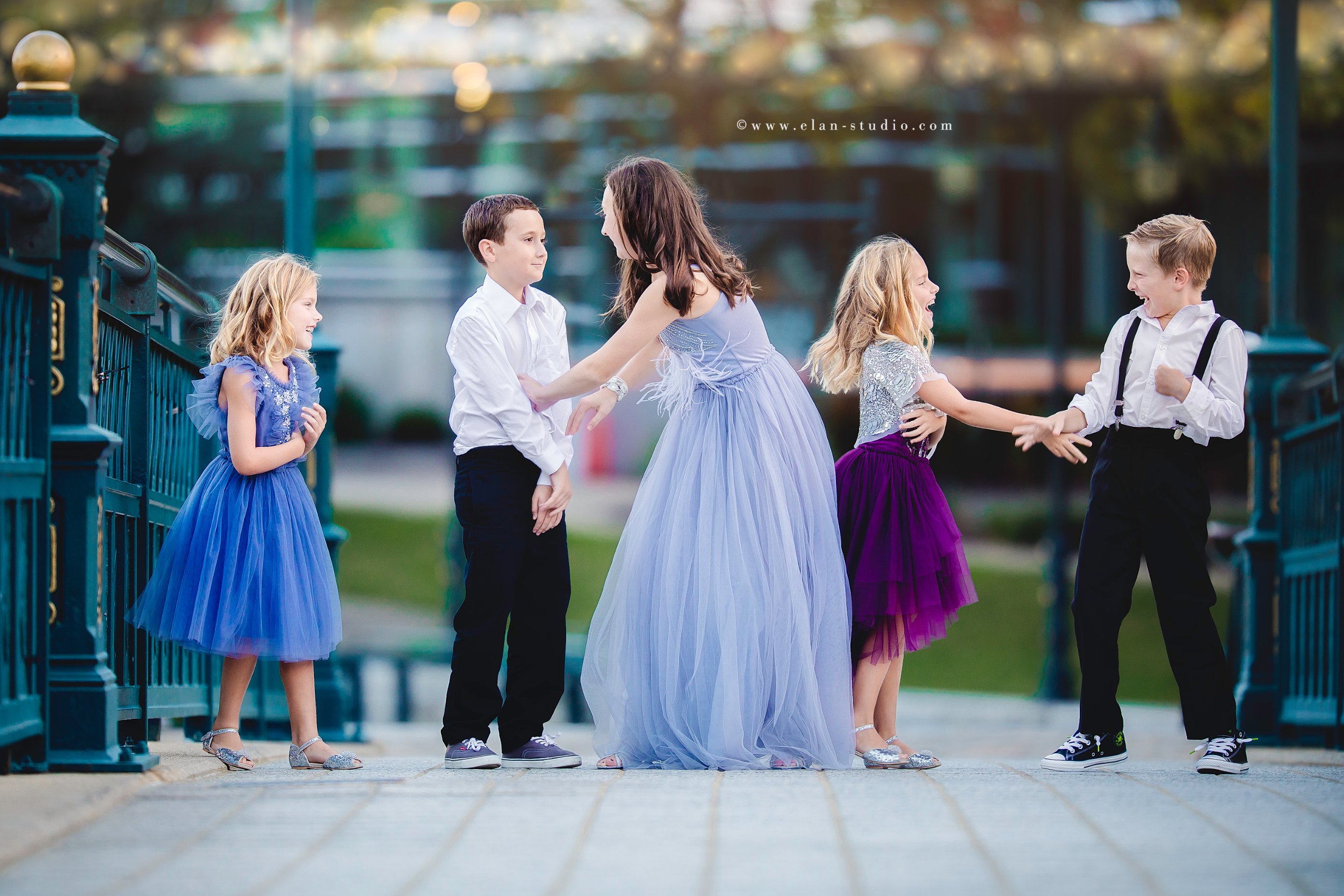 five siblings in formalwear at dusk