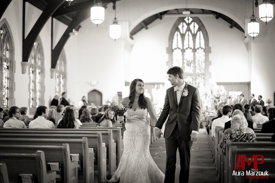 Bride leaves with her new husband at her Reynolda Presbyterian wedding in Winston Salem. © Aura Marzouk Photography