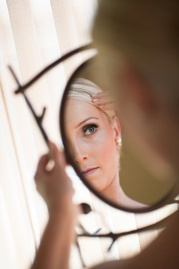 reflection of bride with pearl earrings at Casa Palmero