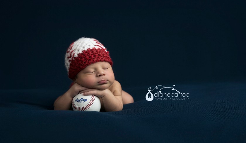 Newborn boy with baseball Riverside