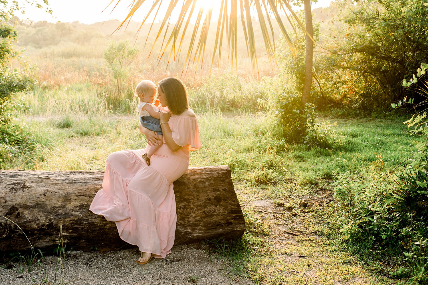 mother holding baby daughter at sunrise, Gainesville family photographer, Rya Duncklee photos