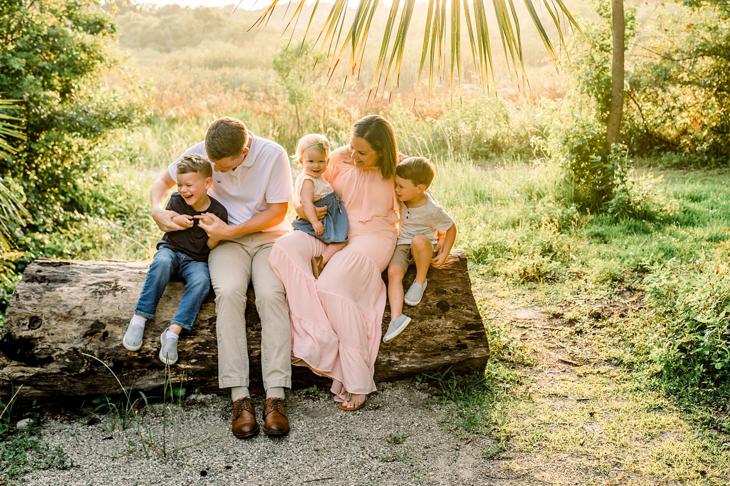 family of 5 sitting on a log, Gainesville family portrait photographer, Ryaphotos