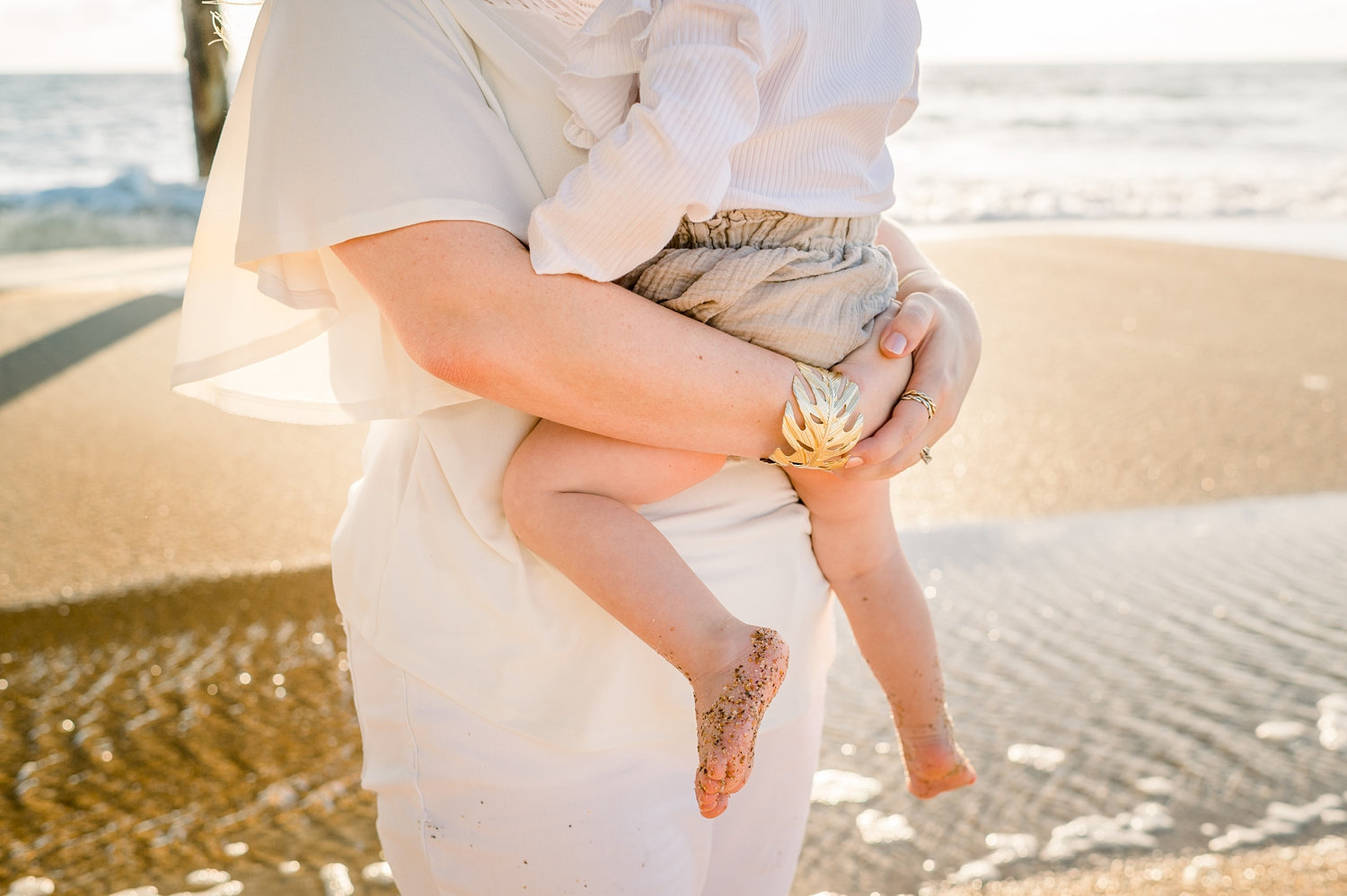 mother holding infant child, full frame image, Saint Augustine Beach, Rya Duncklee