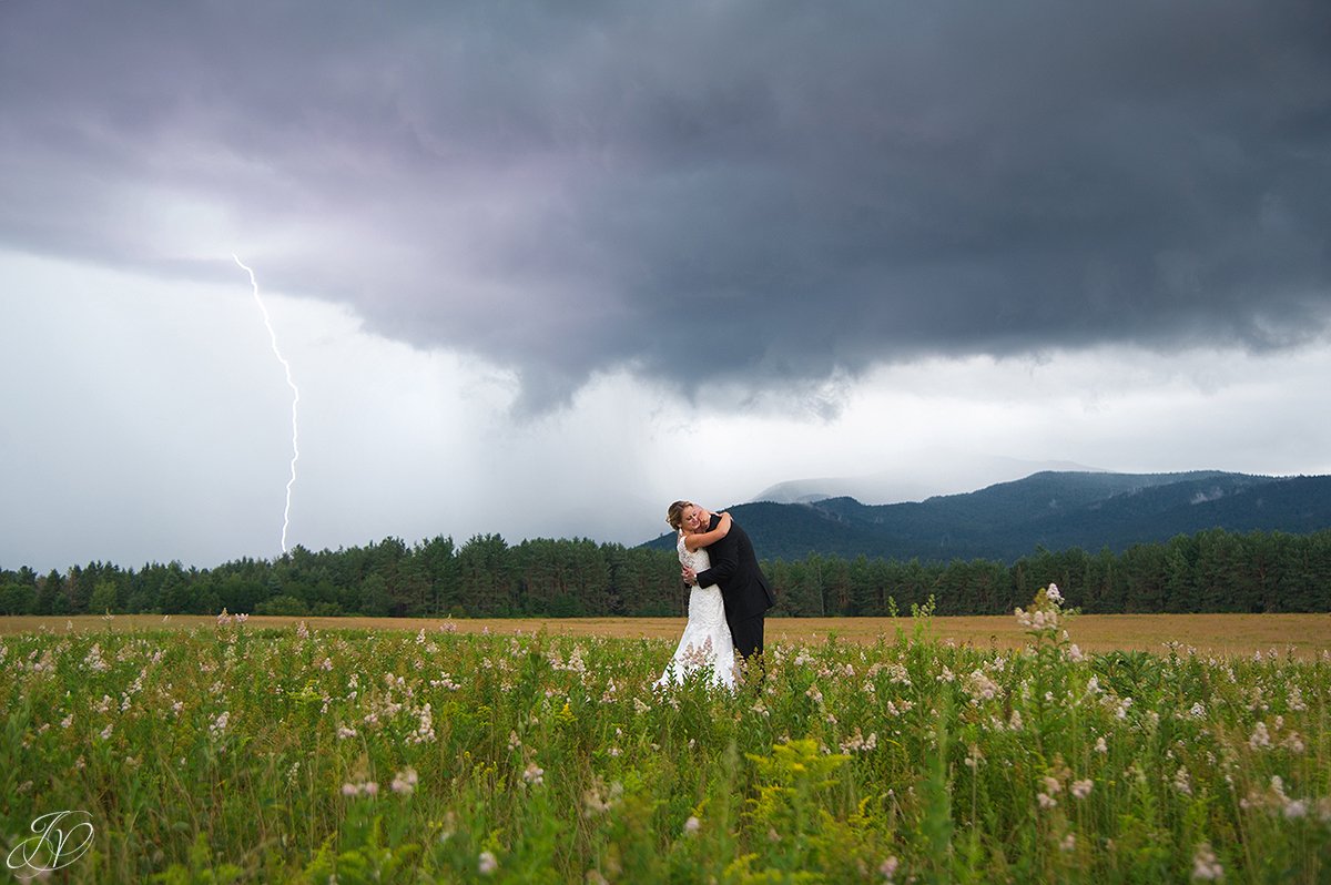 bride and groom lake placid mountain view lightening storm