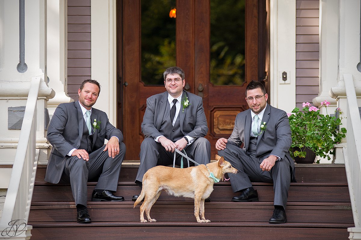 groomsmen on steps with dog