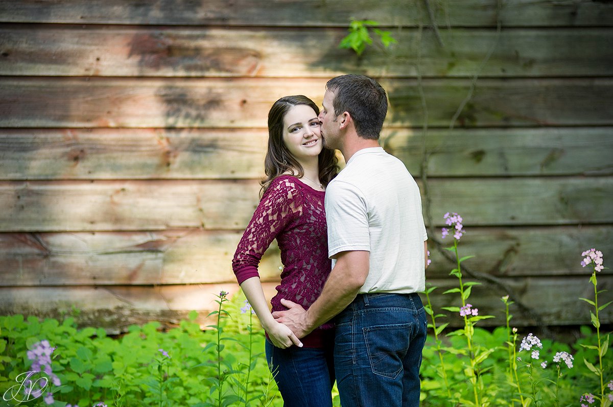cute photo of a couple in front of a barn