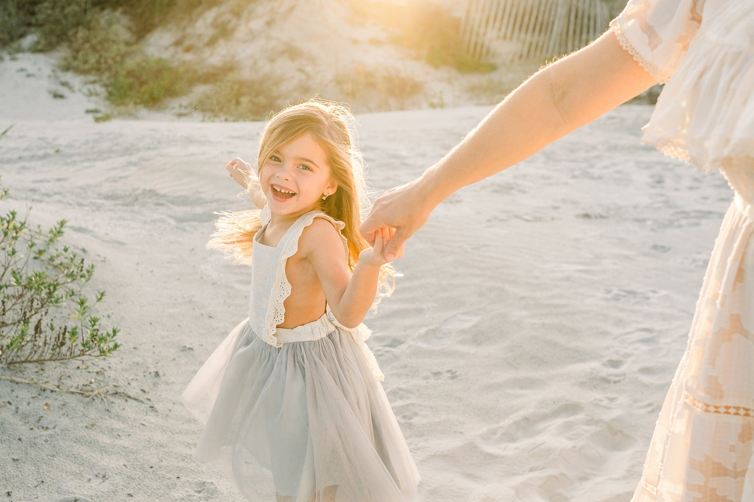 daughter twirling with mom, mother and daughter twirling on a beach, Ryaphotos