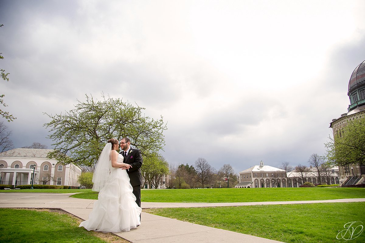 photo of bride and groom with rain clouds