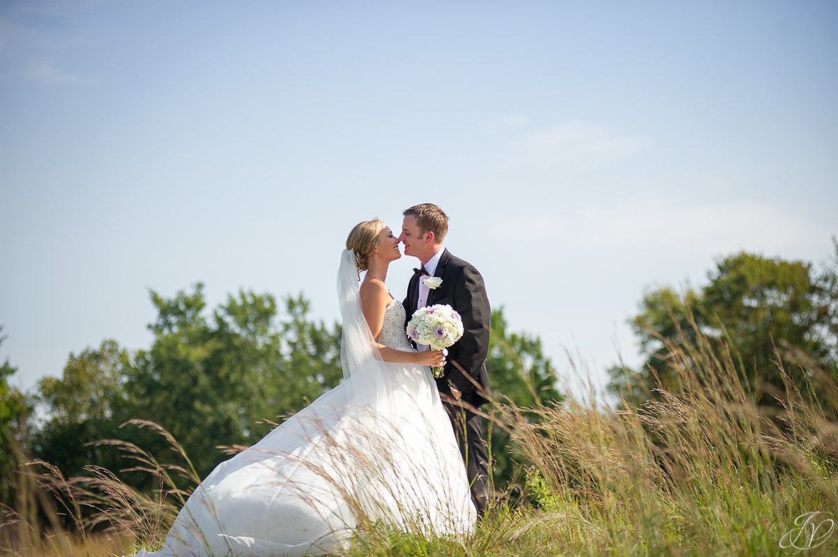 bride and groom almost kiss tall grass