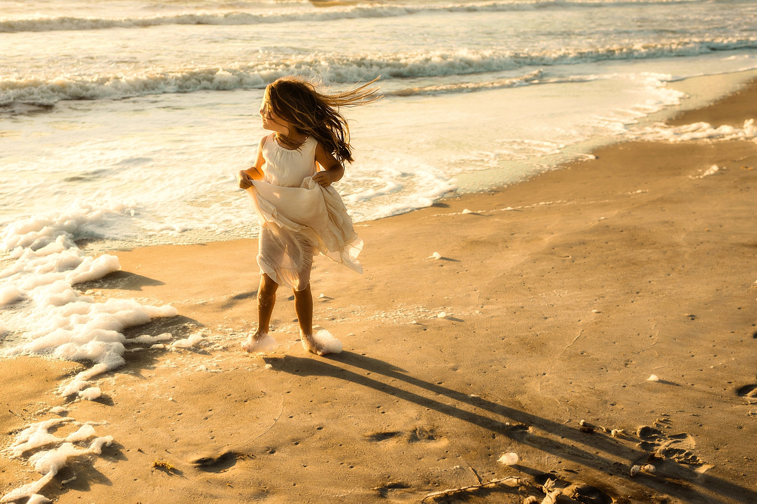 little girl turning her face to the sun, little girl with her hair blowing in the wind, Florida, Ryaphotos