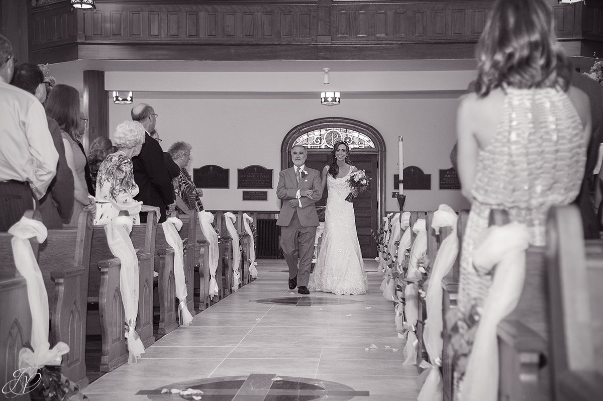 dad walking bride down the aisle at church