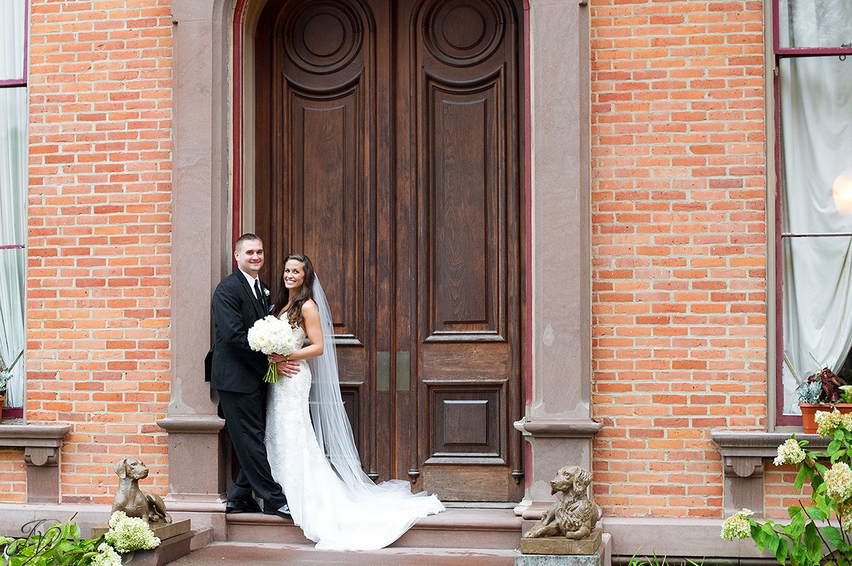 bride and groom portrait exterior brick building canfield casino