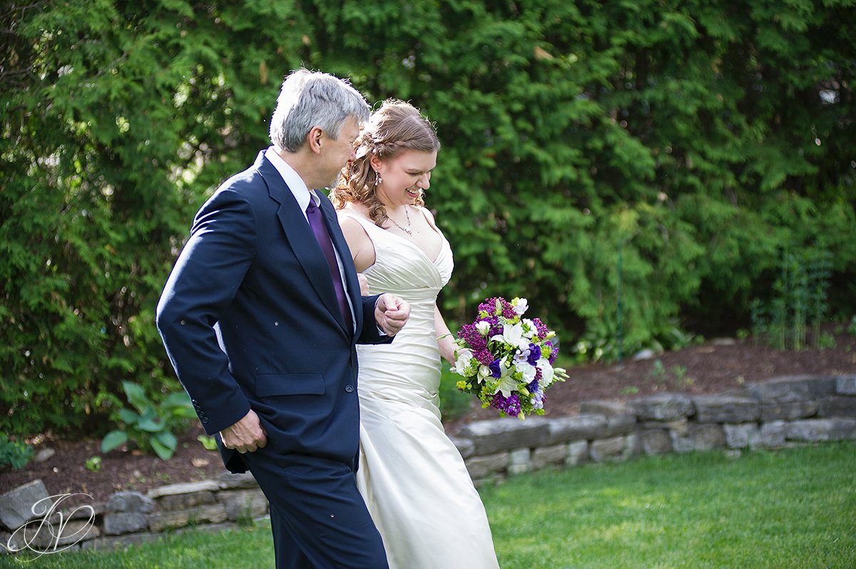 father and bride walking down isle photo, beardslee outdoor ceremony, beardlee castle ceremony site photo, beardslee castle outside ceremony. bridal party photos, bridal party with purple dresses, albany wedding photographer, capital region wedding photographers
