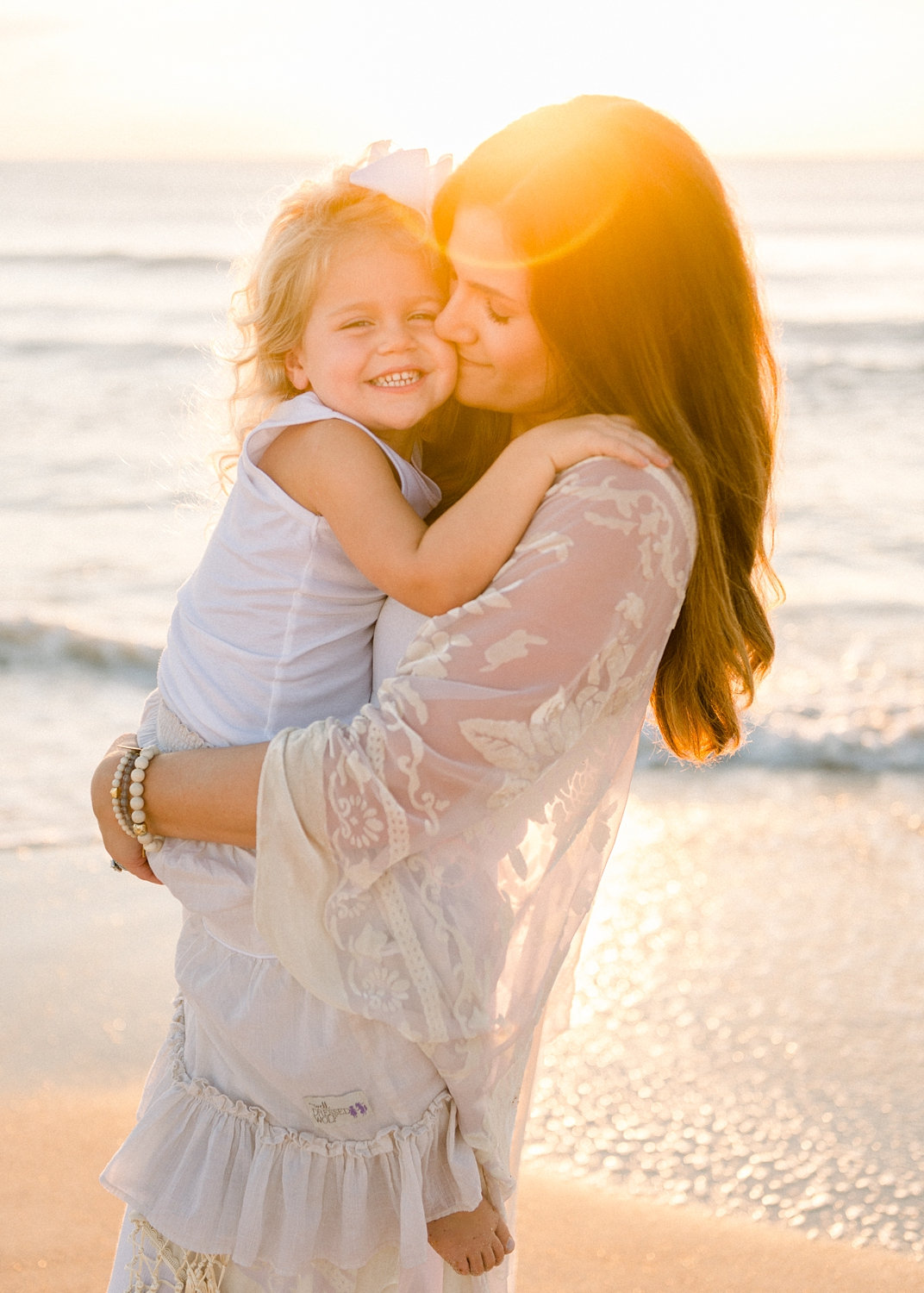 mother holding her little girl, Ponte Vedra Beach, Florida sunrise, Ryaphotos