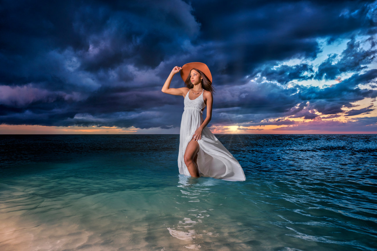high school senior girl posing in white dress in clearwater florida