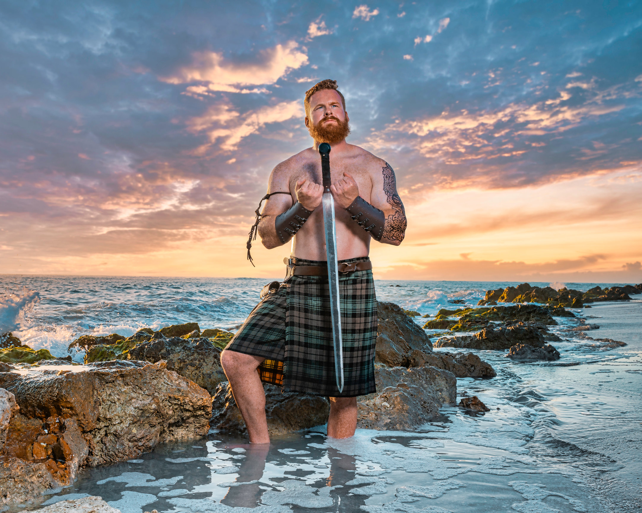 photograph of a Viking with Sword on beach by Jessica McKnight Photography