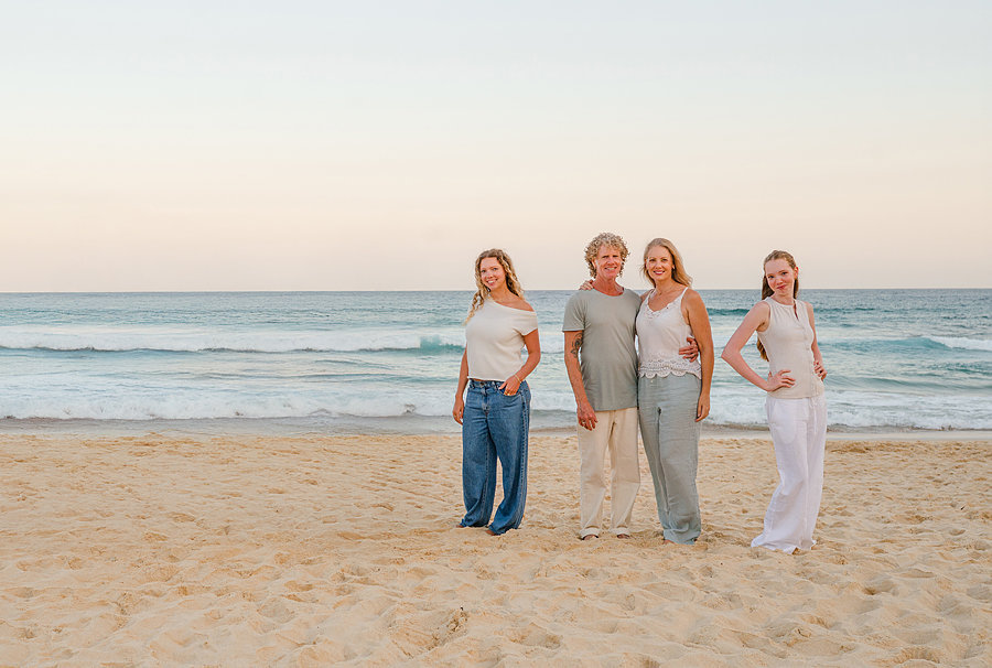 Family standing together during a Bondi beach family vacation photoshoot.