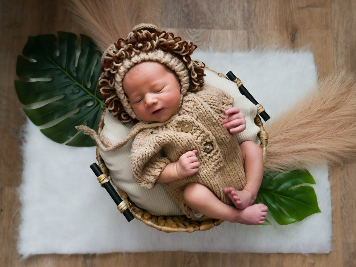 Newborn baby sleeping in basket
