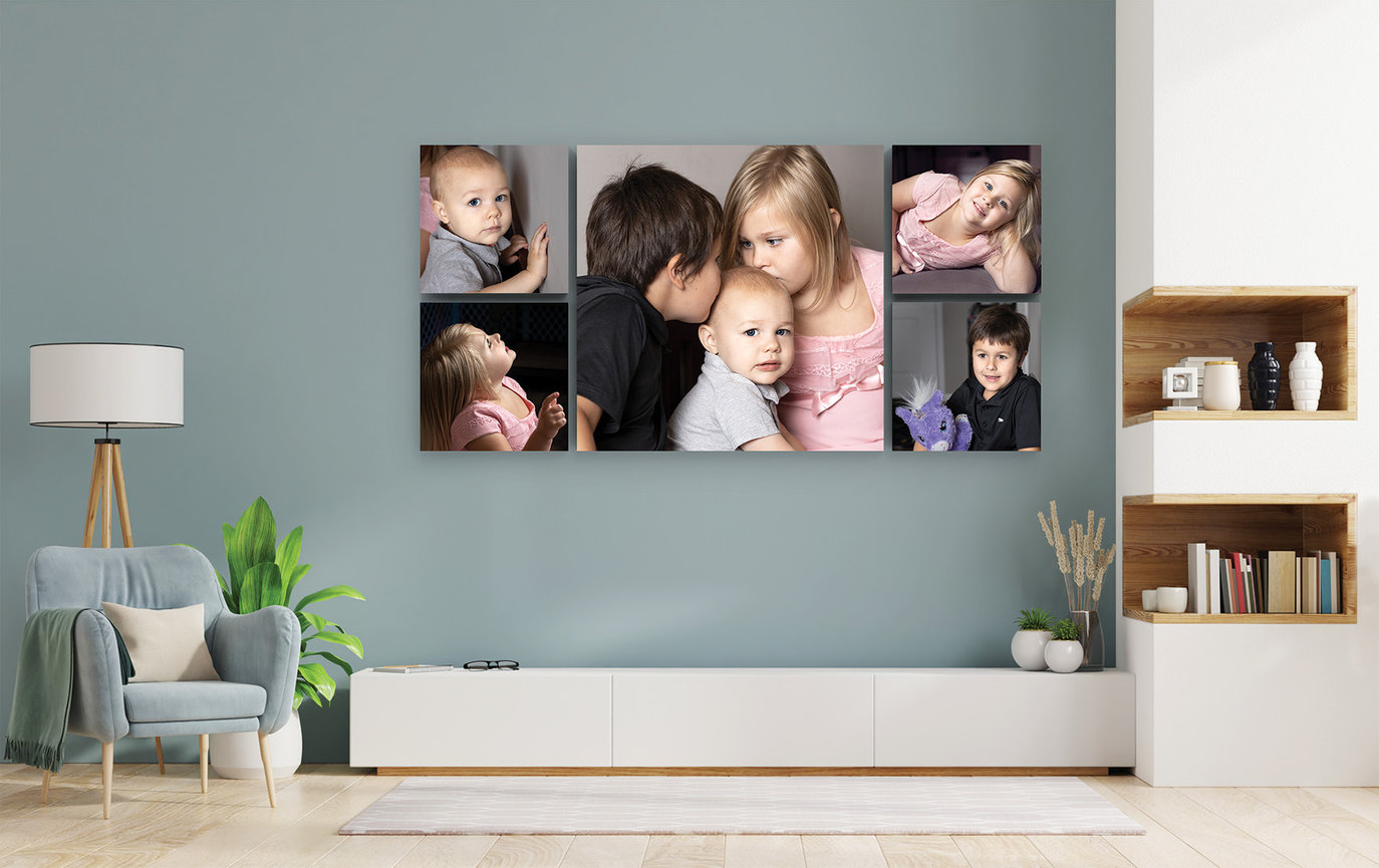 family portrait wall collection arranged as multiple images displayed above console in a modern home interior