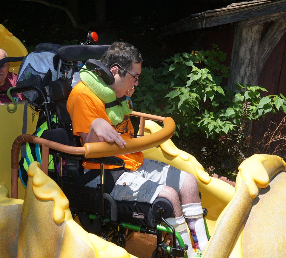 Man in wheelchair on an amusement ride
