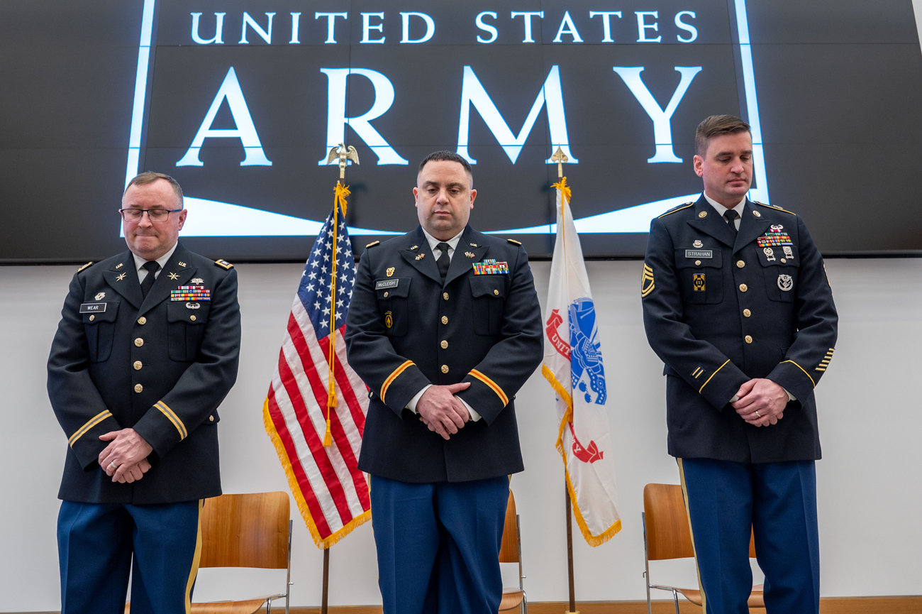 Army Officer bowing his head during prayer at his retirement ceremony