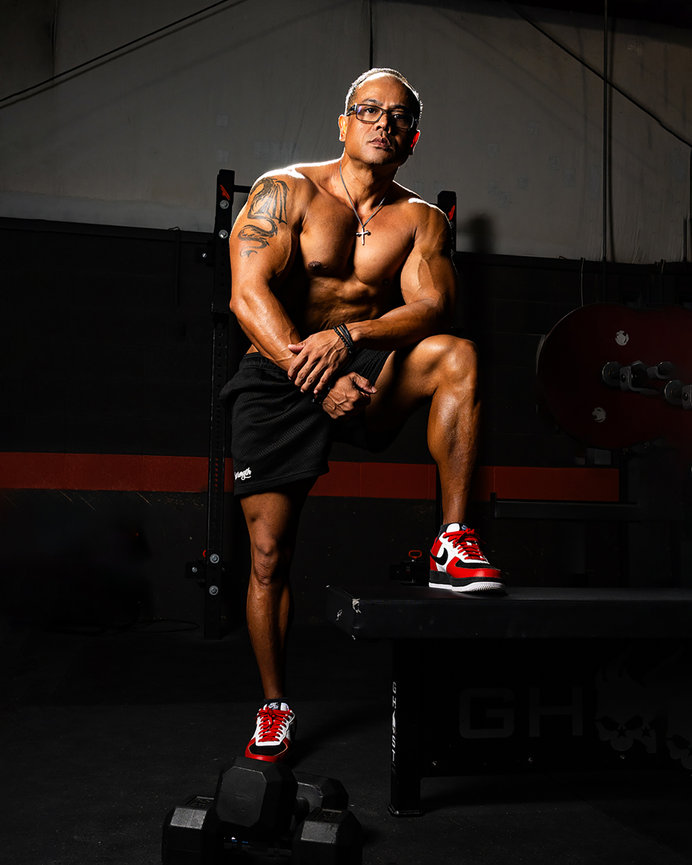 Male bodybuilder showcasing his muscular physique while posing confidently in at the Forge gym in Orem, Utah. Captured by Tre Nelson Photo, specializing in fitness and personal branding photography.