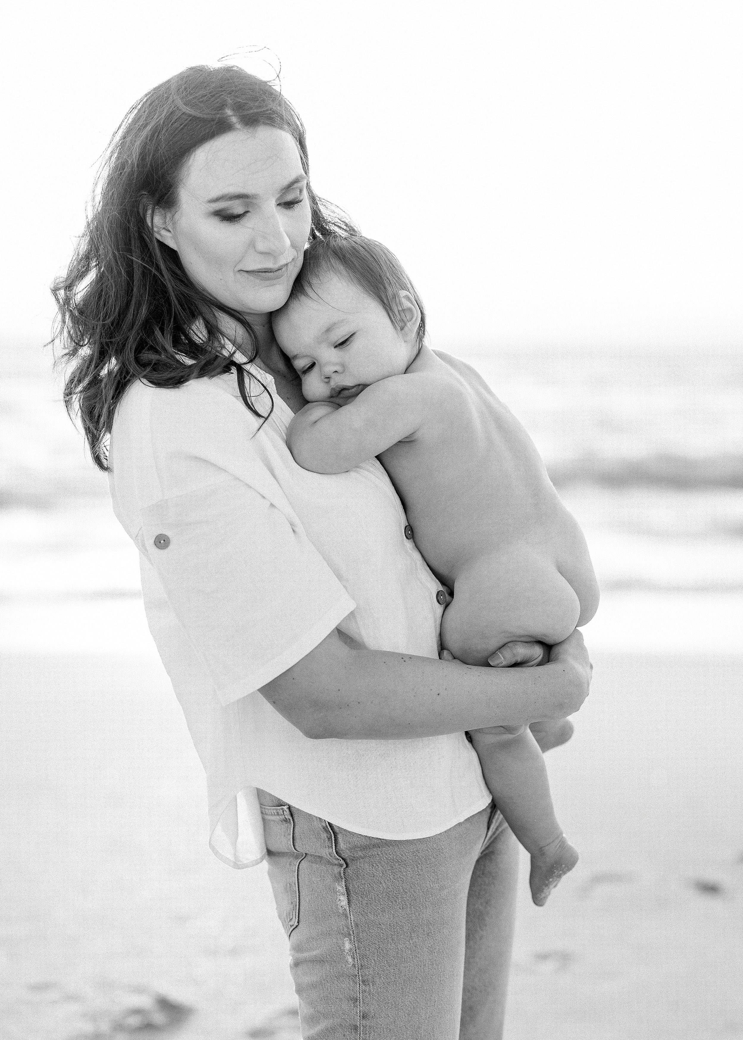 black and white beach portrait of mother and son