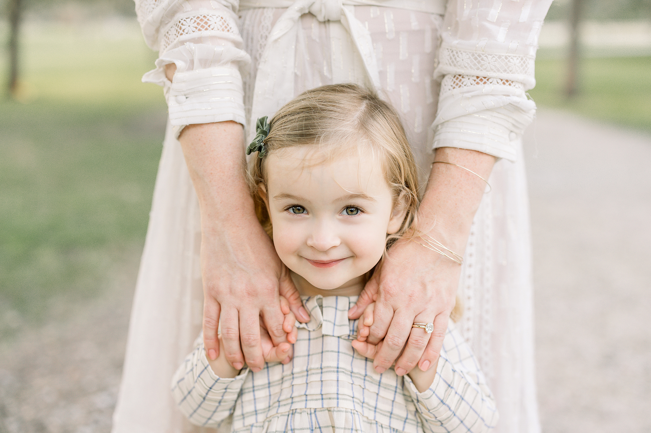 A fall portrait of a little girl with green eyes dressed in vintage clothing.