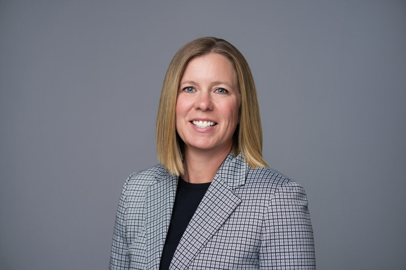 Executive-style professional headshot with studio lighting used for LinkedIn and corporate branding