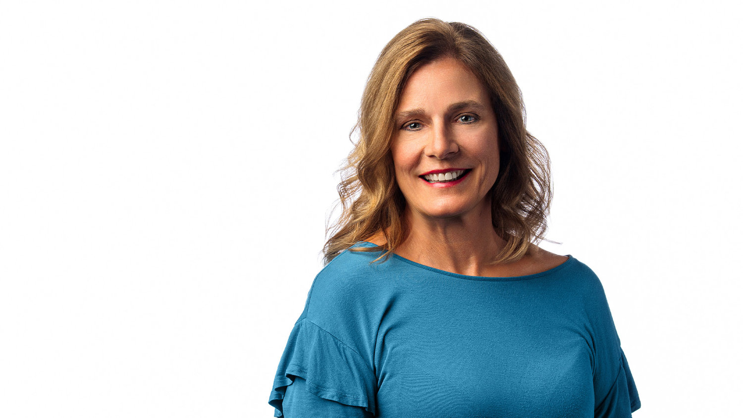 woman in blouse on solid white background for a classic and professional headshot