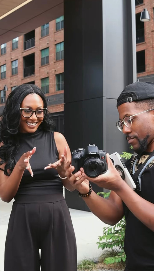 Woman enthusiastically showing camera display