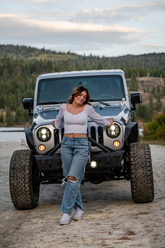 girl senior year photo in mountains in front of jeep in McCall, Idaho