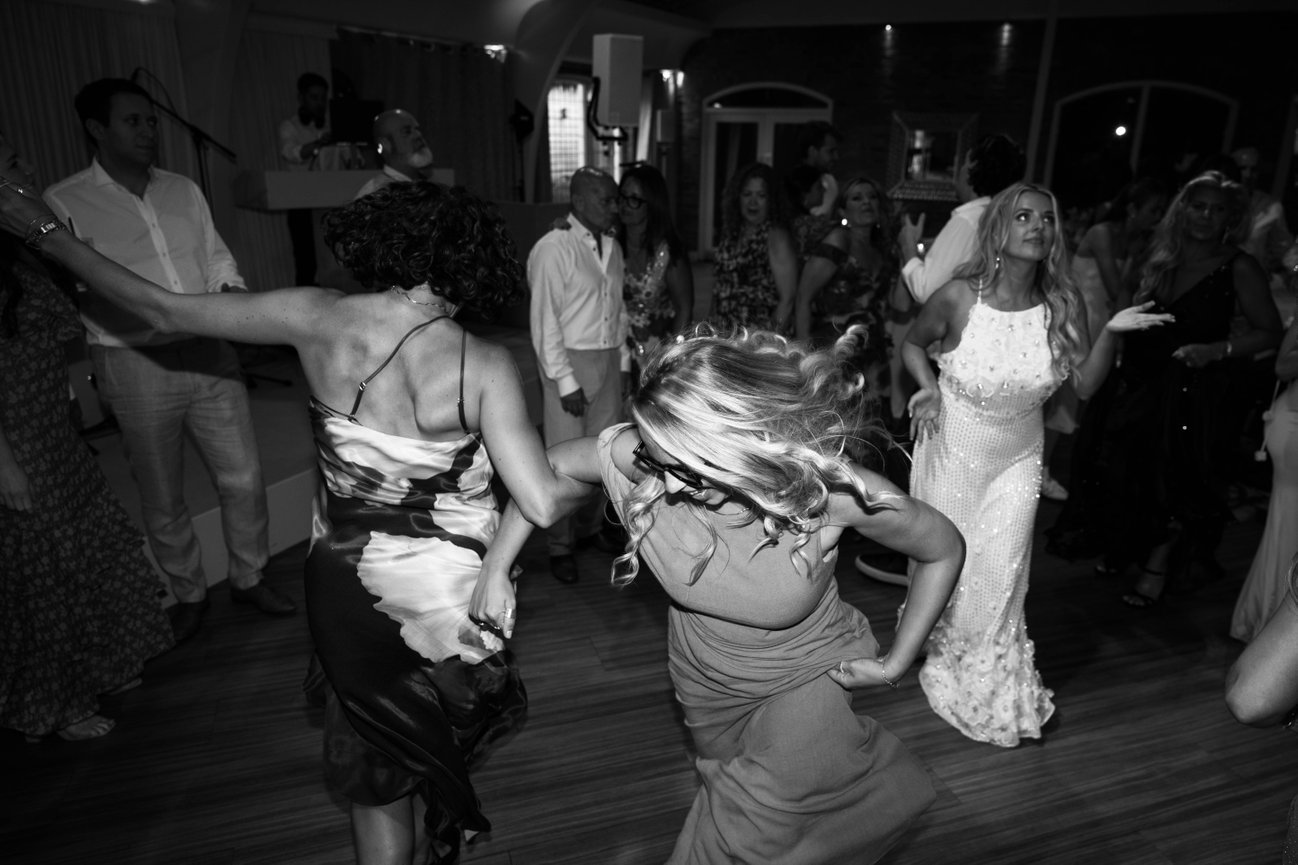 Direct flash editorial photography at Colshaw Hall; capturing the raw, unscripted energy of a wedding reception in monochrome.