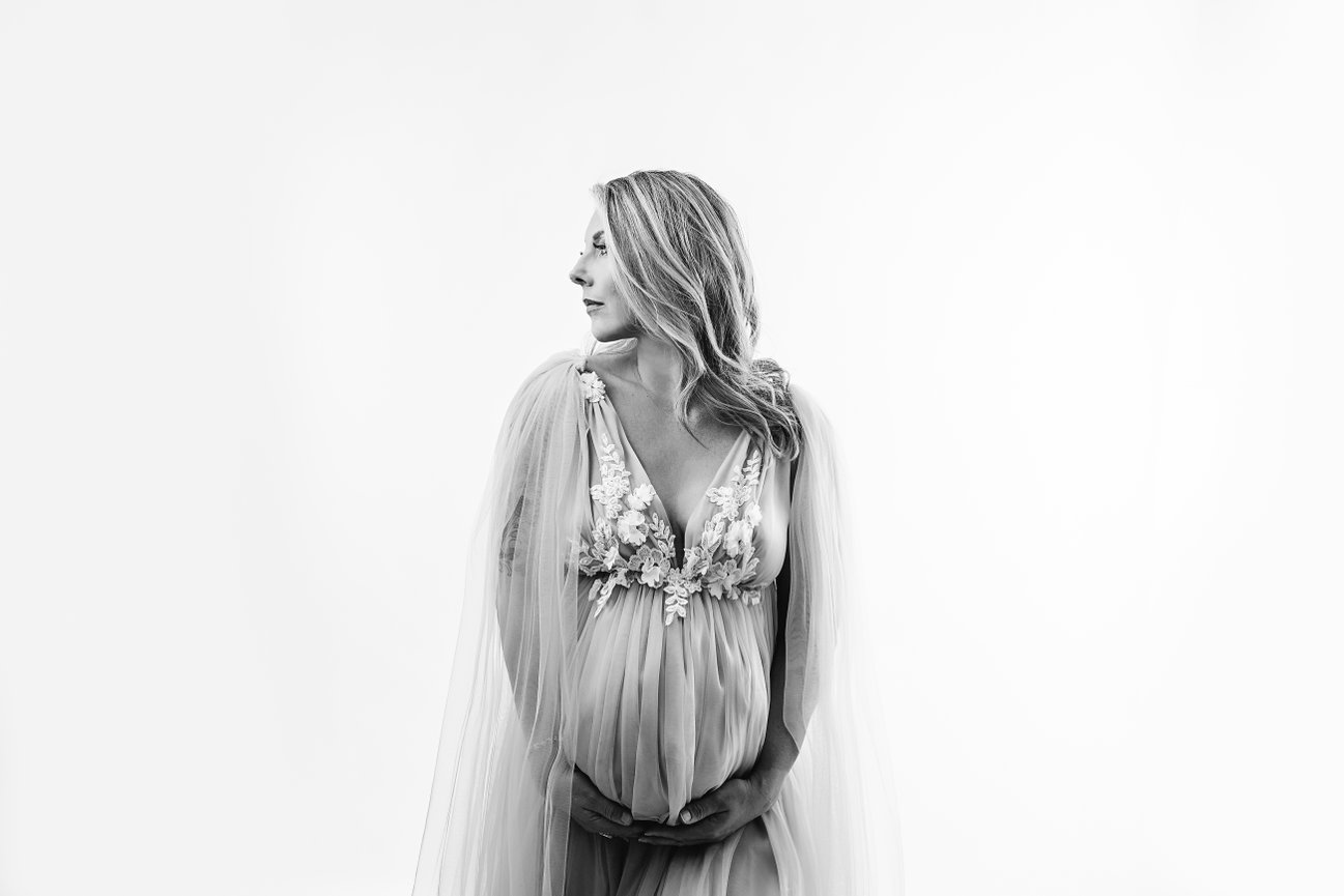 Soft, timeless maternity pose in black and white