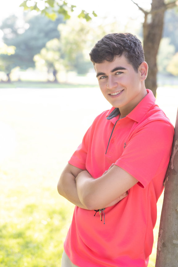 Young man in pink shirt