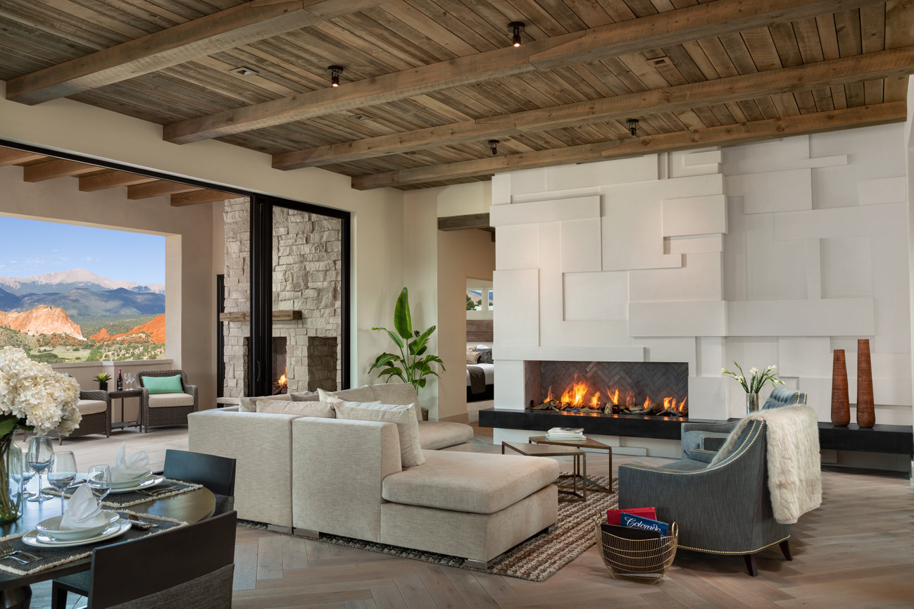 All White Living Room Suite Looking over the Garden of Gods Mountain in Fireplace Setting.