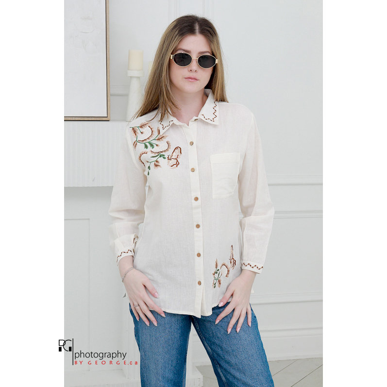 Model wearing embroidered linen summer shirt and sunglasses styled for spring summer fashion photoshoot in Toronto studio.