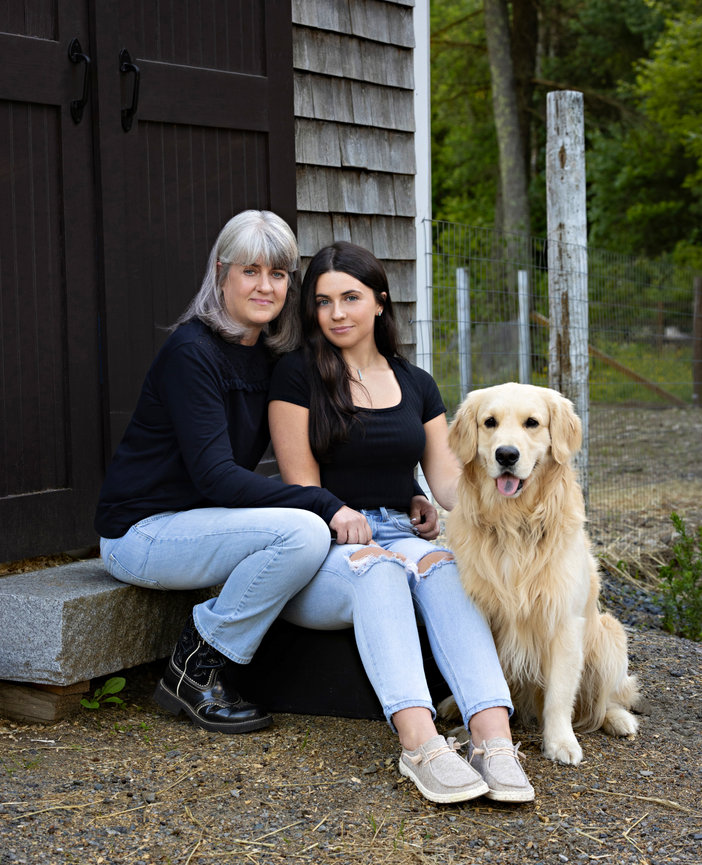 Outdoor family portrait of mom and high school senior girl with golden retriever at family farm house walpole ma