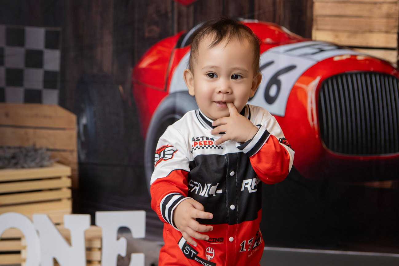 Baby in a Route 66-inspired first birthday setting