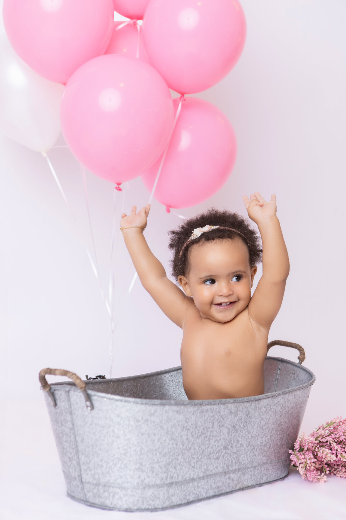 Calgary cake smash photography pink balloons tulle and bubbles first birthday session photo 23
