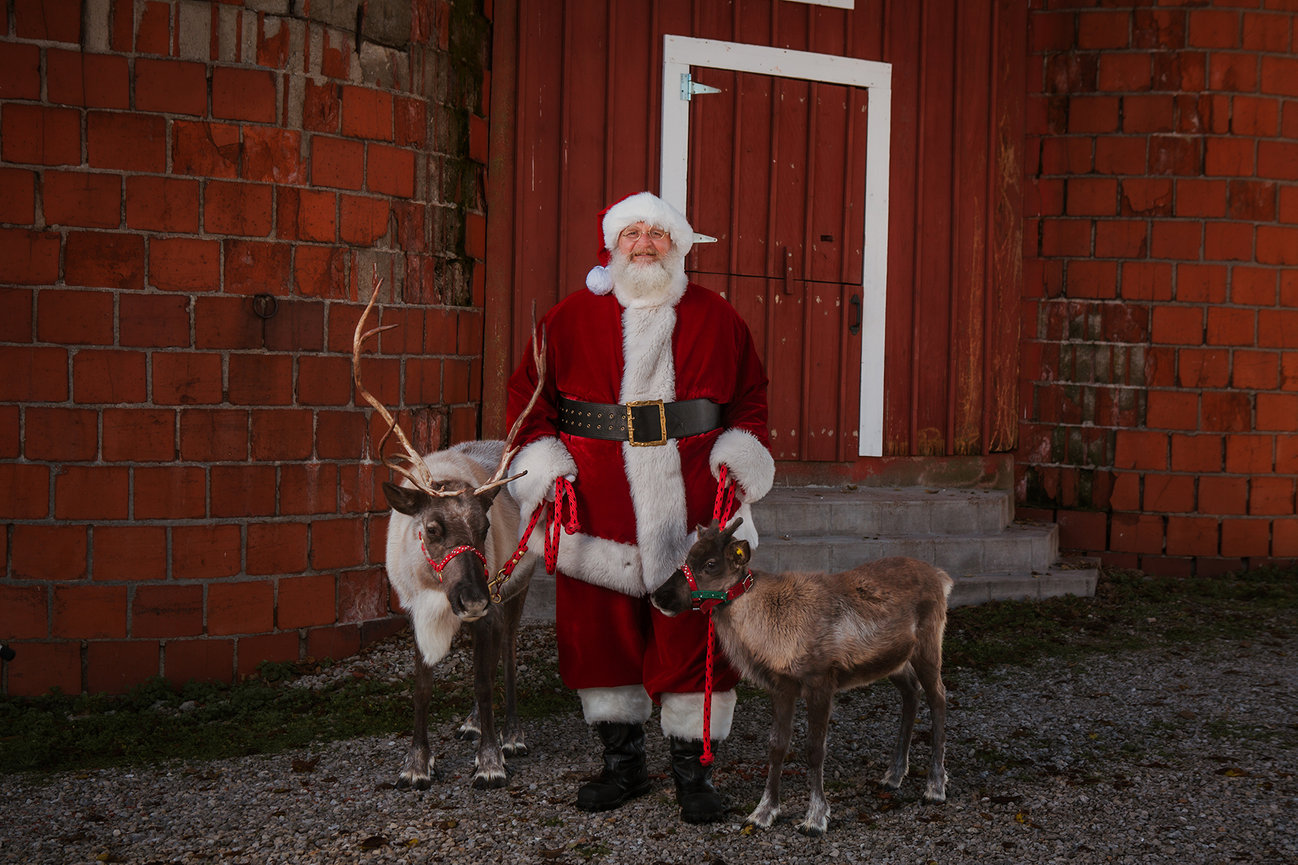 Santa stands with two reindeer at the older location, pictured as an example from previous years