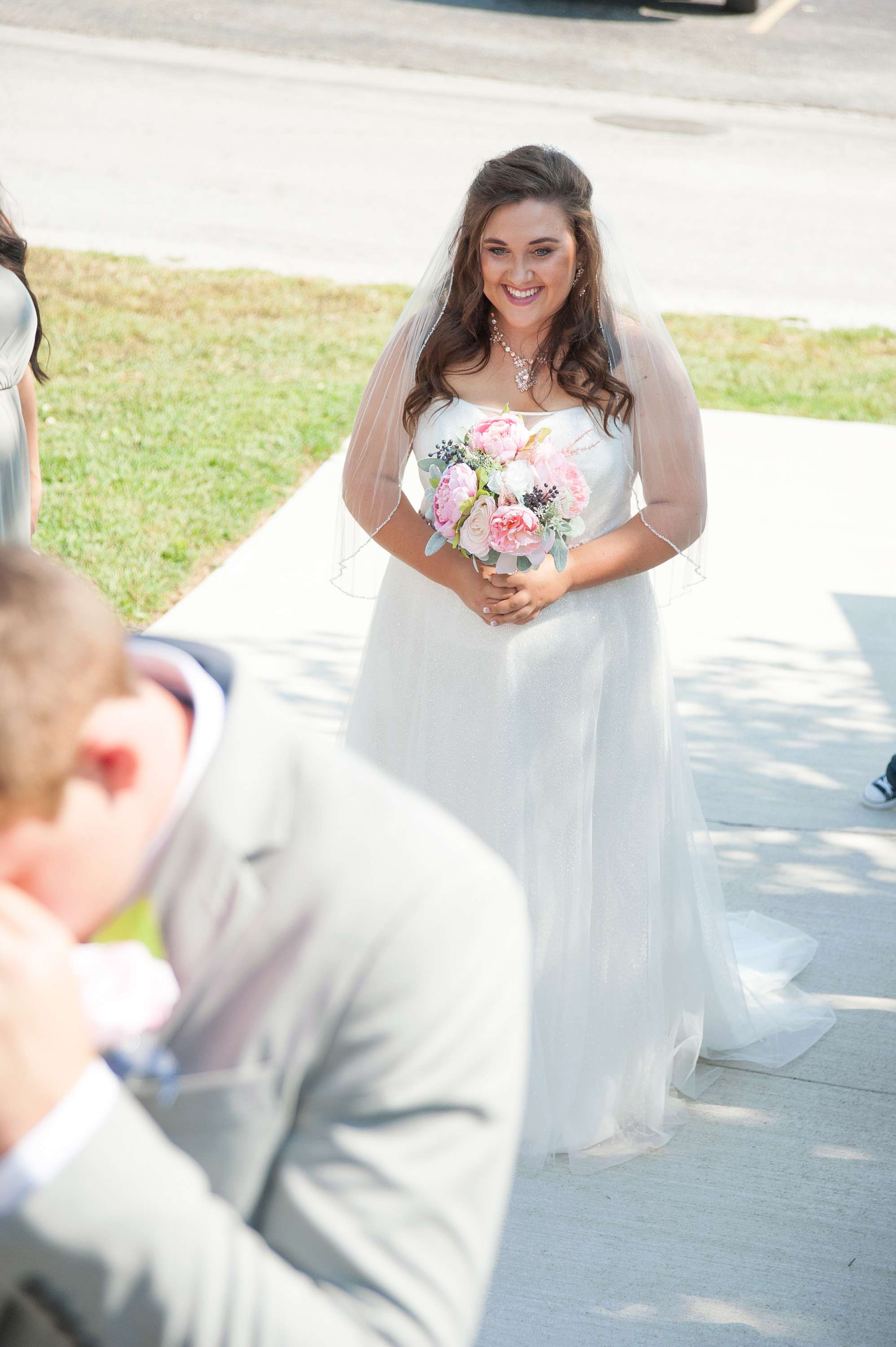 Bride waiting for her groom to turn and see her at the first look.